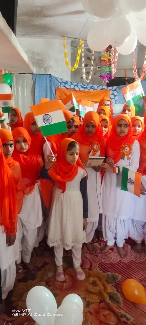A student holding the Indian flag
