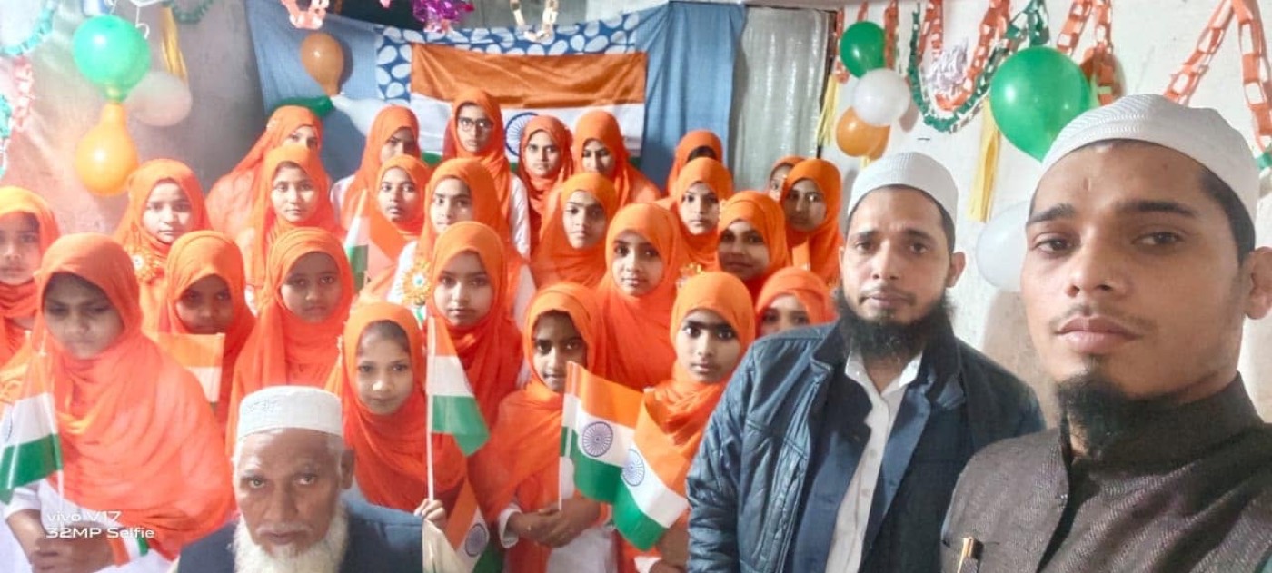 Trust members and students celebrating Independence Day with Indian flags